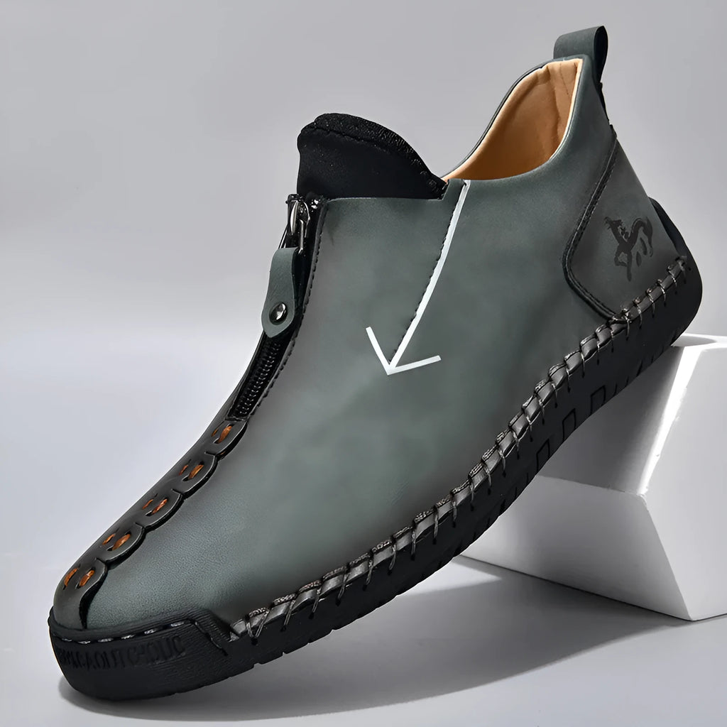 Men's black casual Martin boots with a front zip, round toe, and low rubber sole.