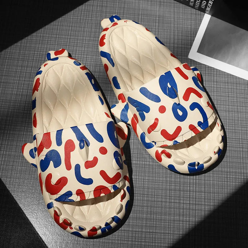 Open-toe EVA foam slippers with a shark design on the upper, shown in a beige colour.