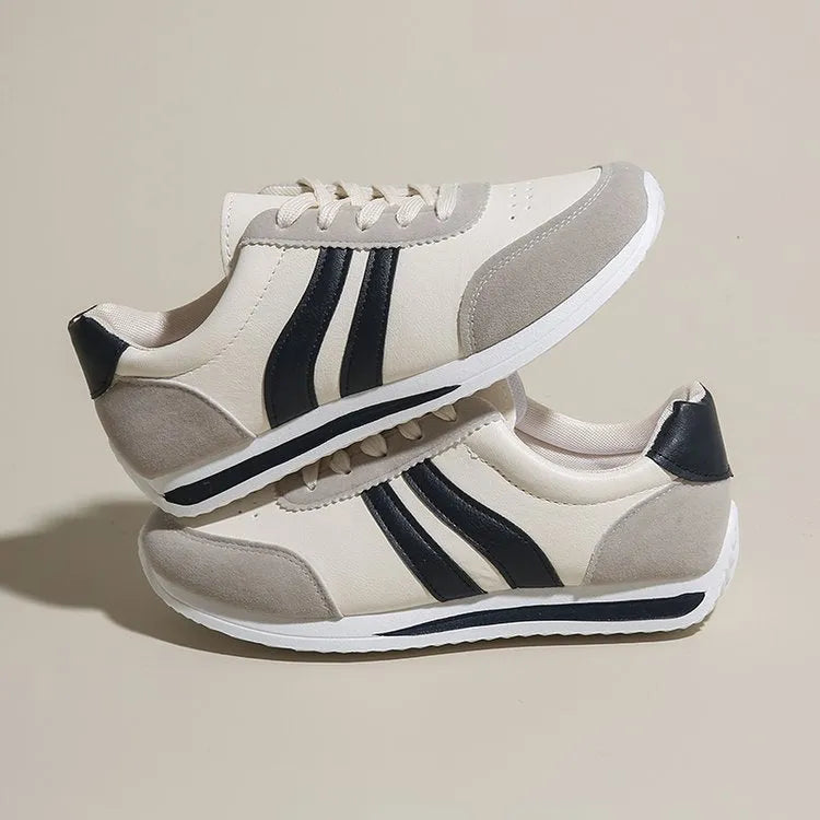 Red and blue low-top lace-up casual sneakers with a PU mesh upper and rubber sole.