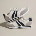 Red and blue low-top lace-up casual sneakers with a PU mesh upper and rubber sole.
