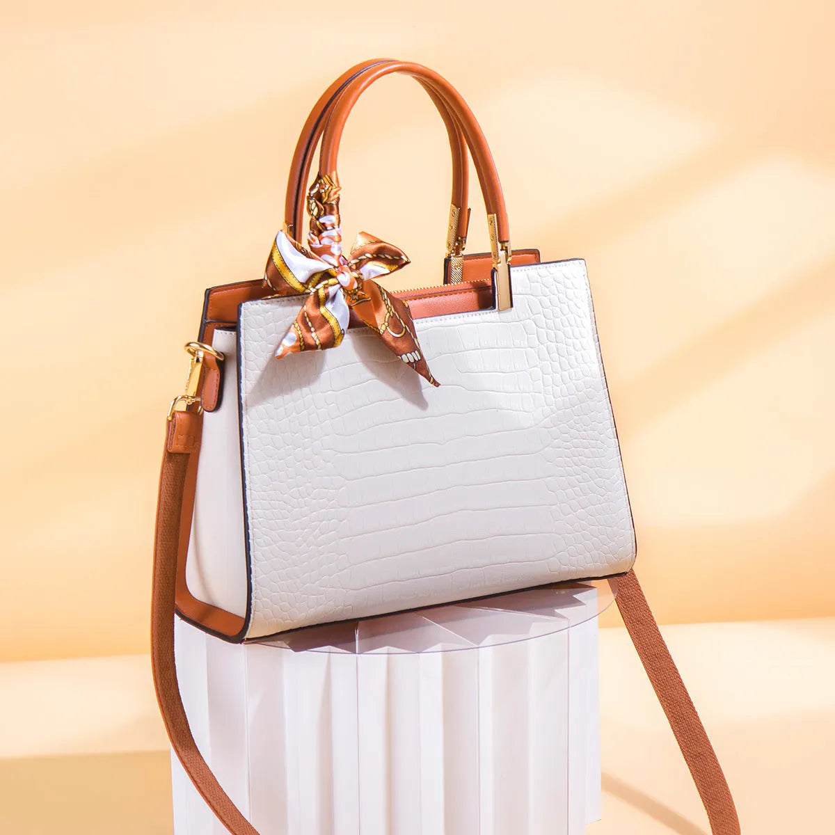 Milky white women's large shoulder handbag with internal compartments and slit pocket.