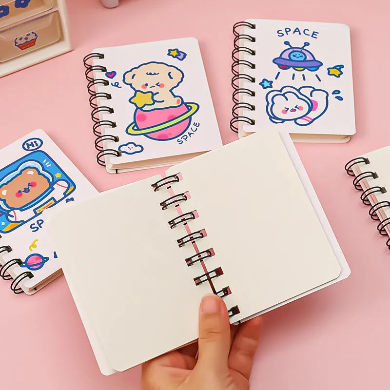Astronaut portable pocket flipper notebook showing 10.5cm by 8cm dimensions with spiral binding
