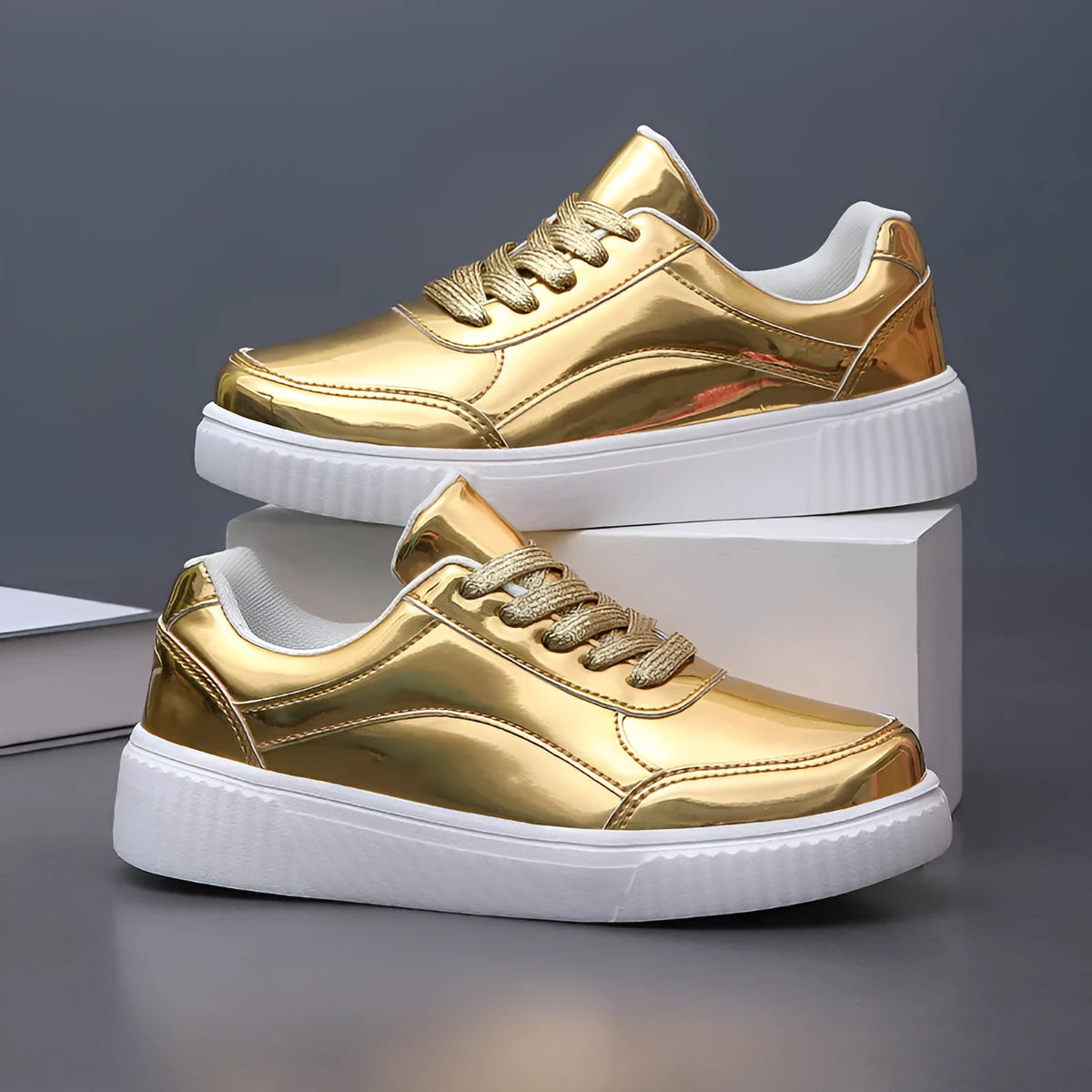 Rose gold and gold sequinned platform sneakers with round toe and thick MD sole.