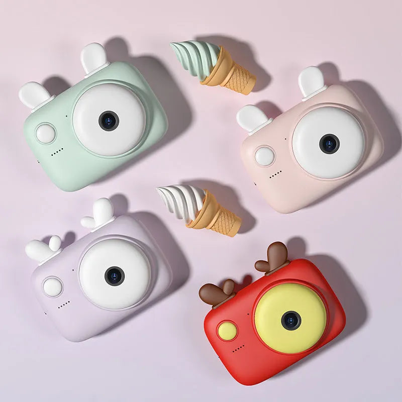 A2 Macaron shaped kids digital camera with colour options, showing front and rear cameras and a 2.4 inch screen.