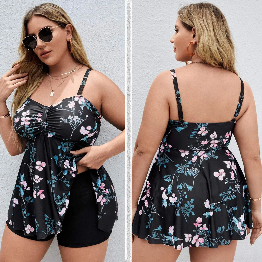 Women's floral print one-piece swimsuit on a hanger, showing split colour design and plus size fit.
