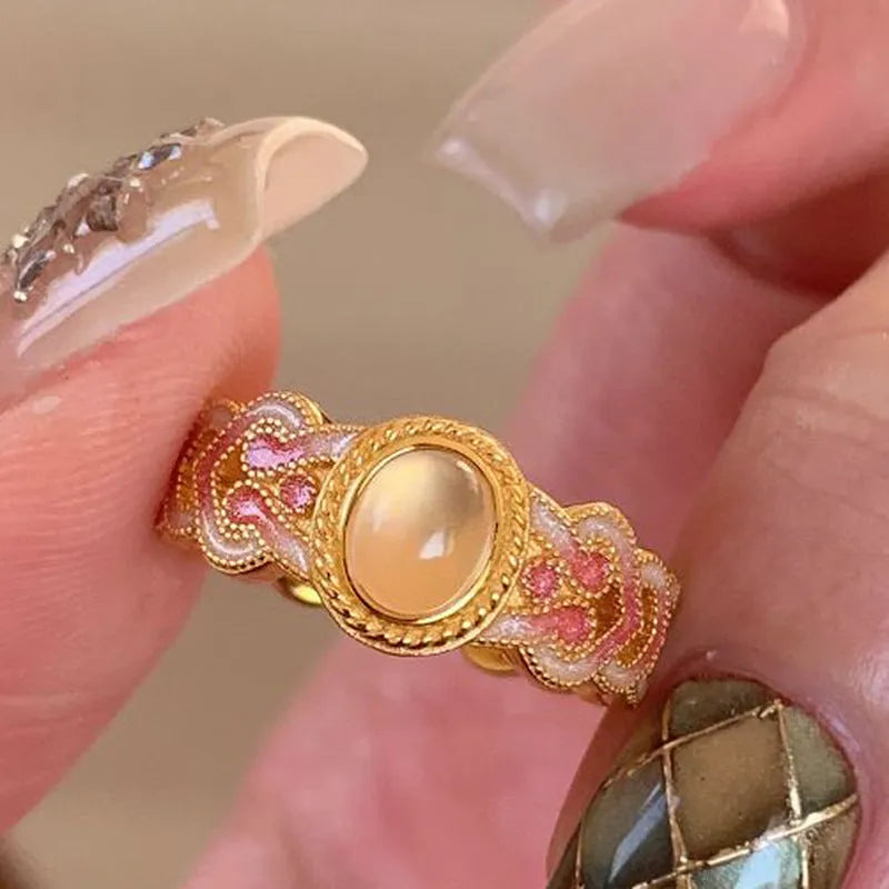 Pink crystal enamel geometric open mouth ring for women with gold plating.