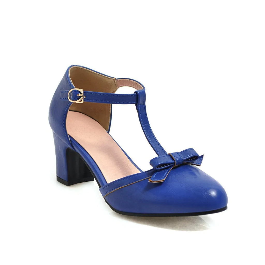 Women's apricot chunky heel sandals with a bow detail and adjustable buckle strap.