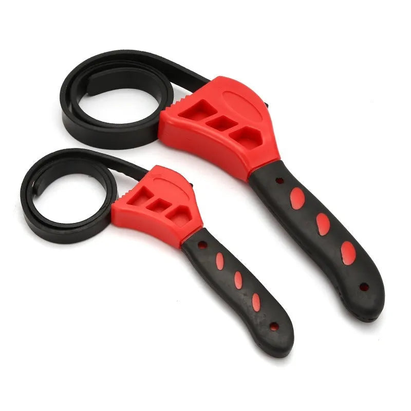 A 6-inch and an 8-inch adjustable rubber strap wrench with plastic handles on a workbench.