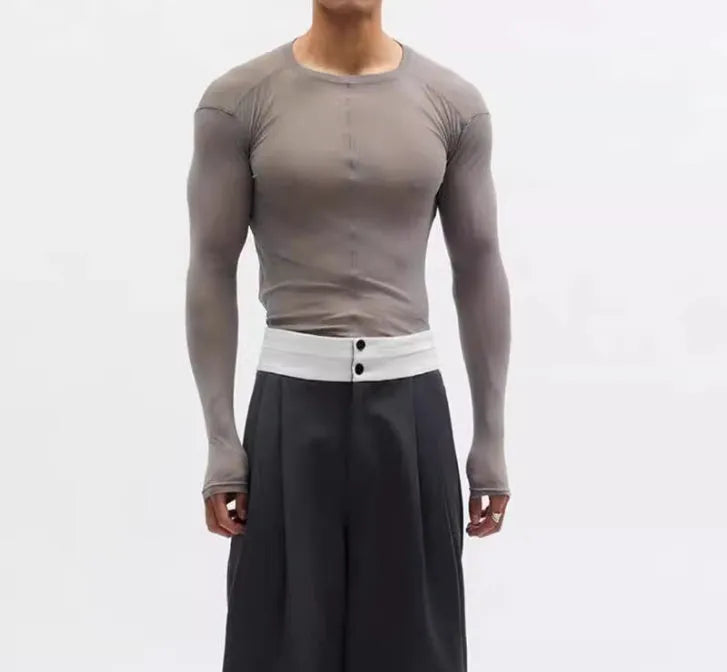 Black slim-fit mesh see-through long sleeve pullover on a model, showing texture.