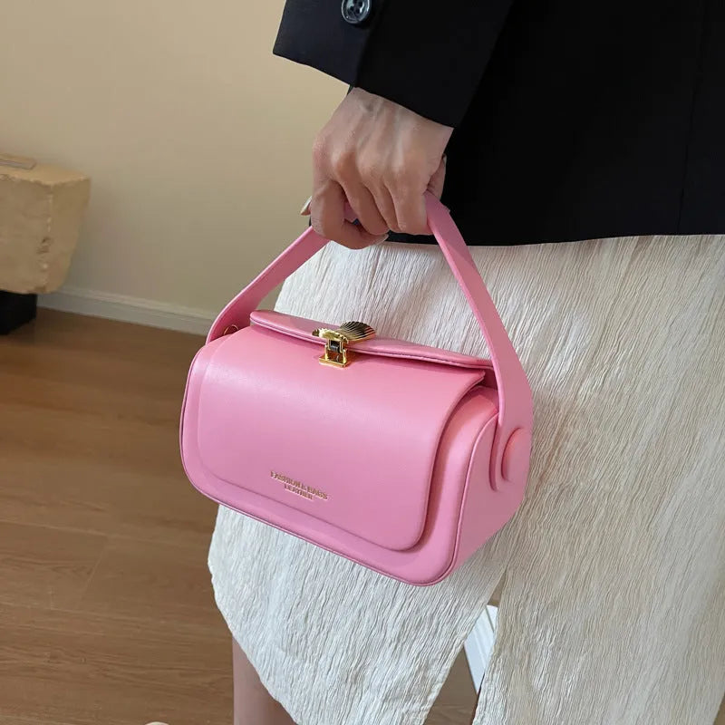 Women's personalised shoulder messenger bag in PU leather with letter detailing and stitching.