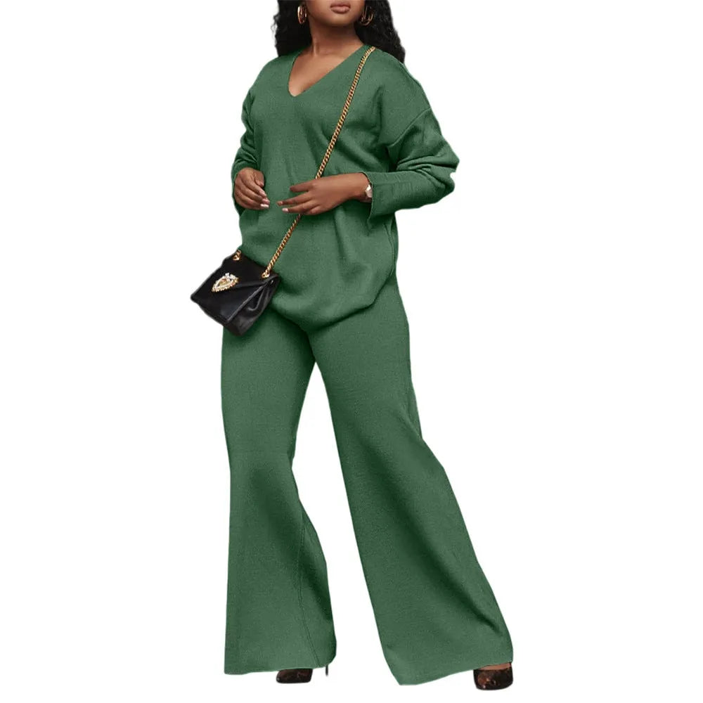 Brown women's casual two-piece suede suit with split sleeve top and trousers on a model.
