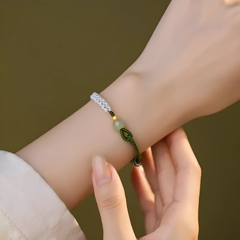Hetian jade and sterling silver Chinese national bracelet on spring green cord carrying strap