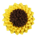Yellow sunflower shaped dog snuffle mat with fleece petals for hiding treats during nosework training
