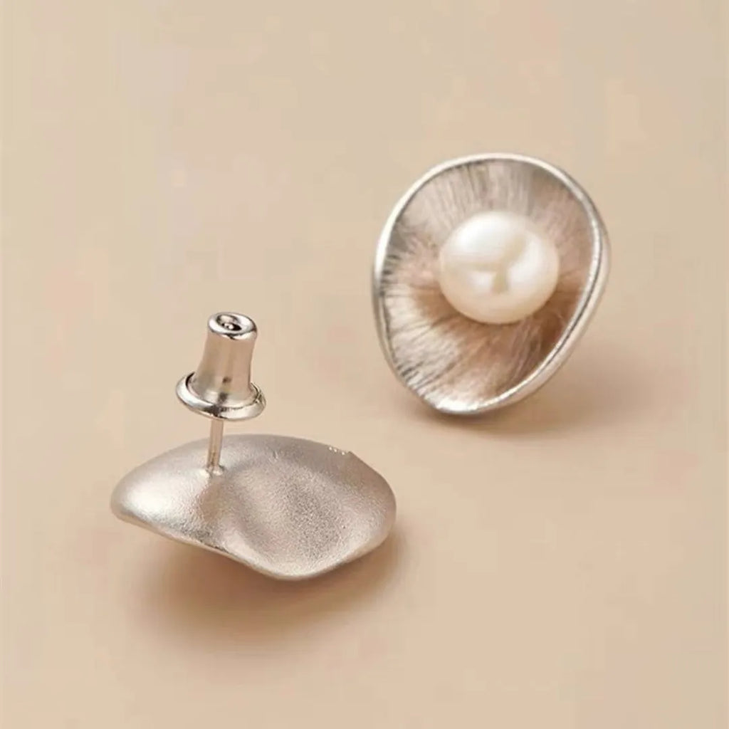 Gold coloured geometric pearl sterling silver needle ear studs for women.