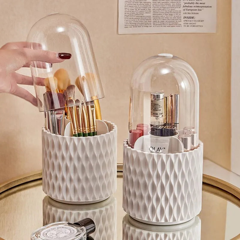 White rotating acrylic makeup brush holder with transparent lid on a desktop