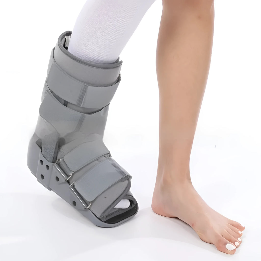 Grey and black Achilles tendon rehabilitation fixed support walking boot with adjustable straps.
