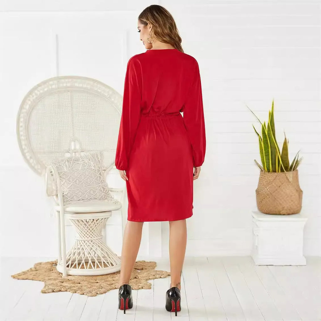 Women's black A-line midi dress with elastic waist and cinched belt, long sleeve cardigan-style