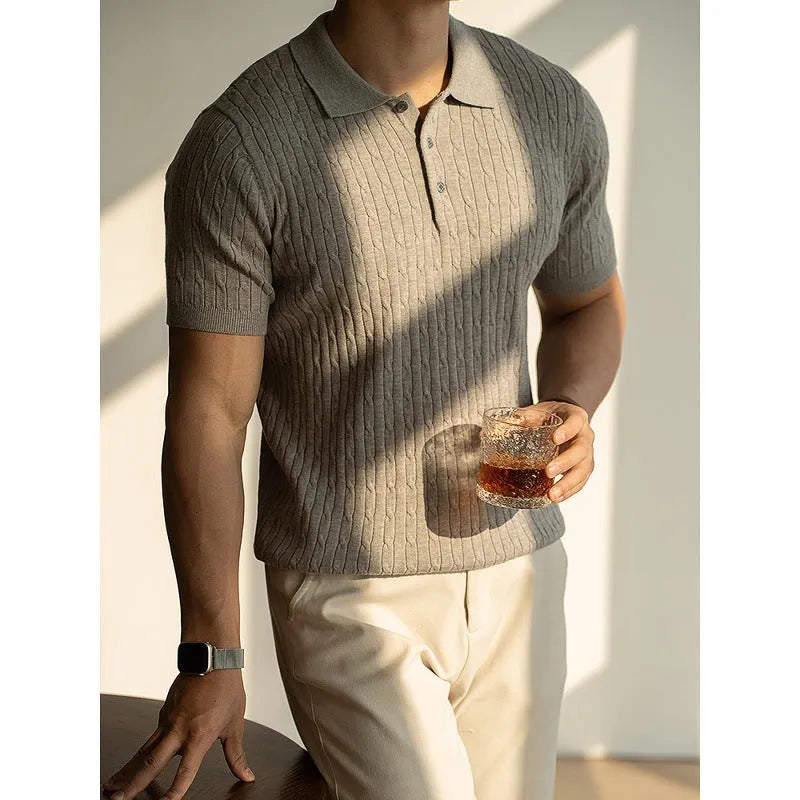 Men's khaki short sleeve business casual top laid flat, showing collar and sleeve detail.