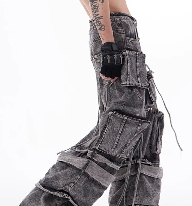 Grey distressed denim overalls for men with rope stitch detailing on the legs and chest.
