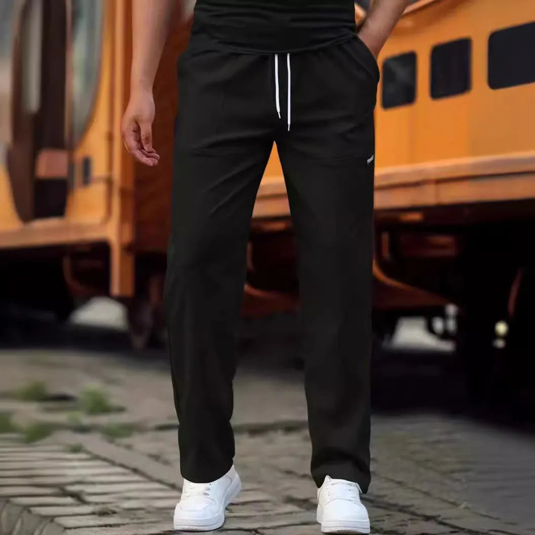 Men's polyester trousers in light grey colour shown flat