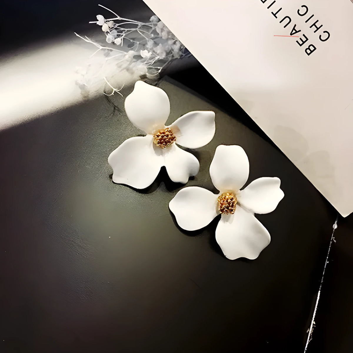 Women's flower stud earrings in alloy with electroplated pink or white finish