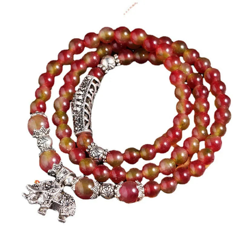 Natural watermelon crystal bracelet with Chinese knot closure and geometric beads