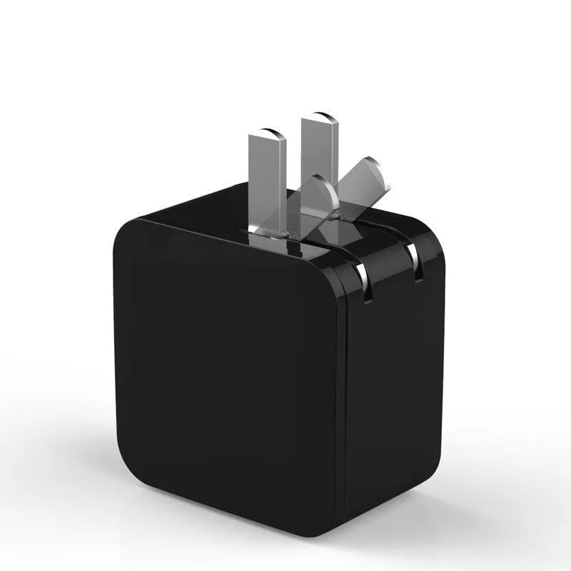 Black dual USB fast travel charger with digital display showing voltage reading and UK three-pin plug