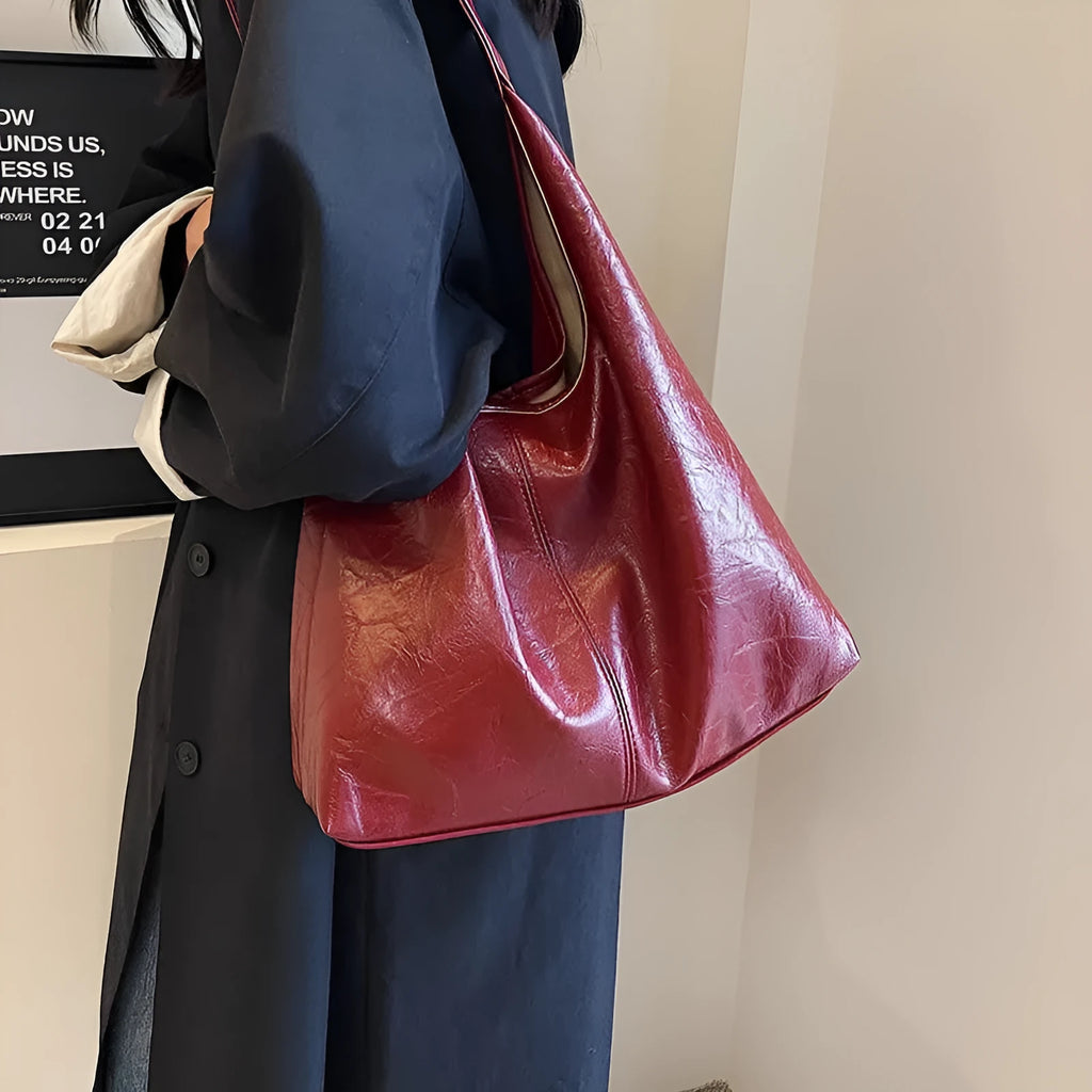 Soft leather casual shoulder bag with sandwich pocket design and large storage capacity
