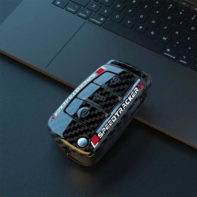 Carbon fibre pattern car key cover with mirrored surface elements in carbon black colour