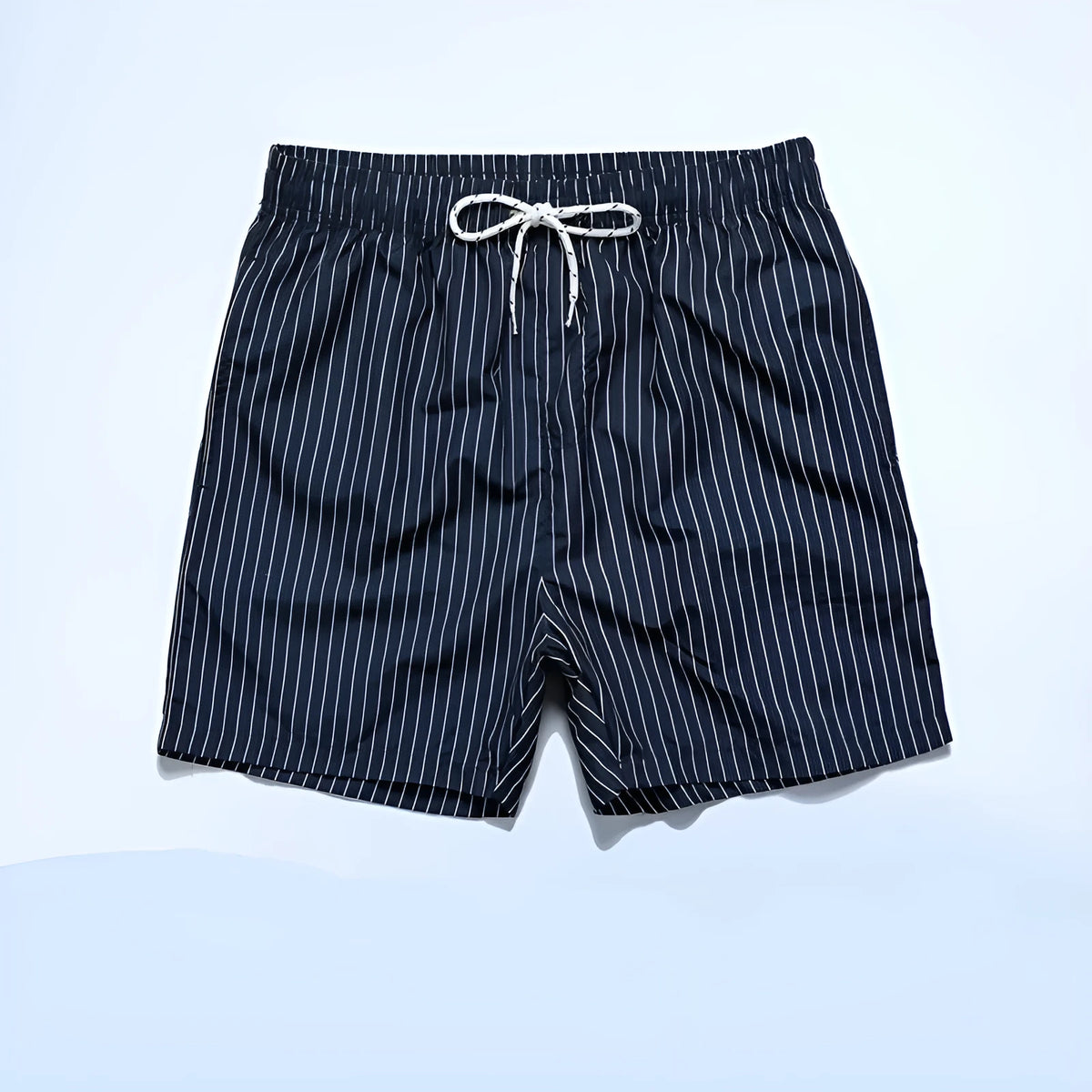 Navy blue striped beach shorts with straight leg opening and triangle lining, flat lay.