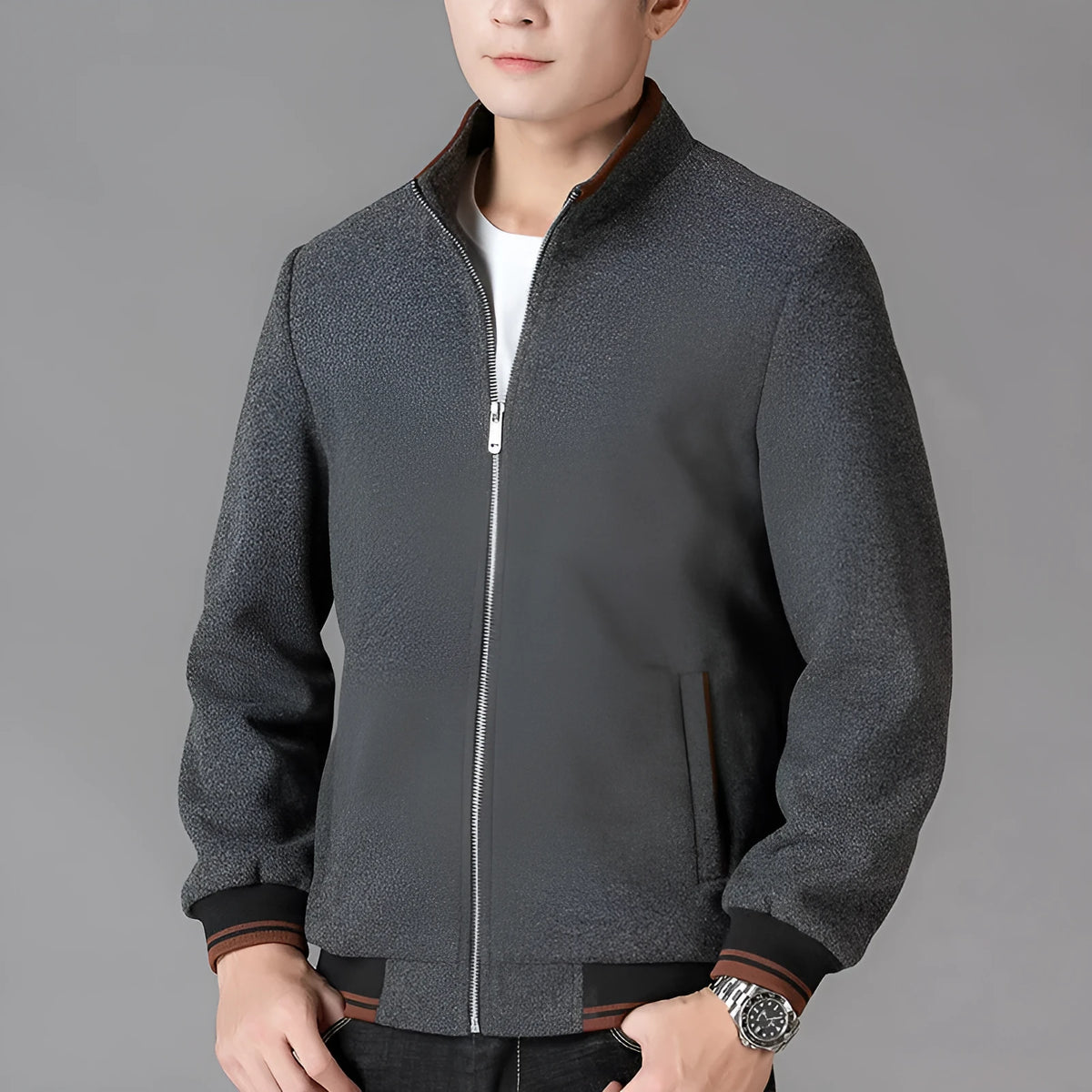 Men's gray fleece sports jacket with long sleeves and a chest pocket.