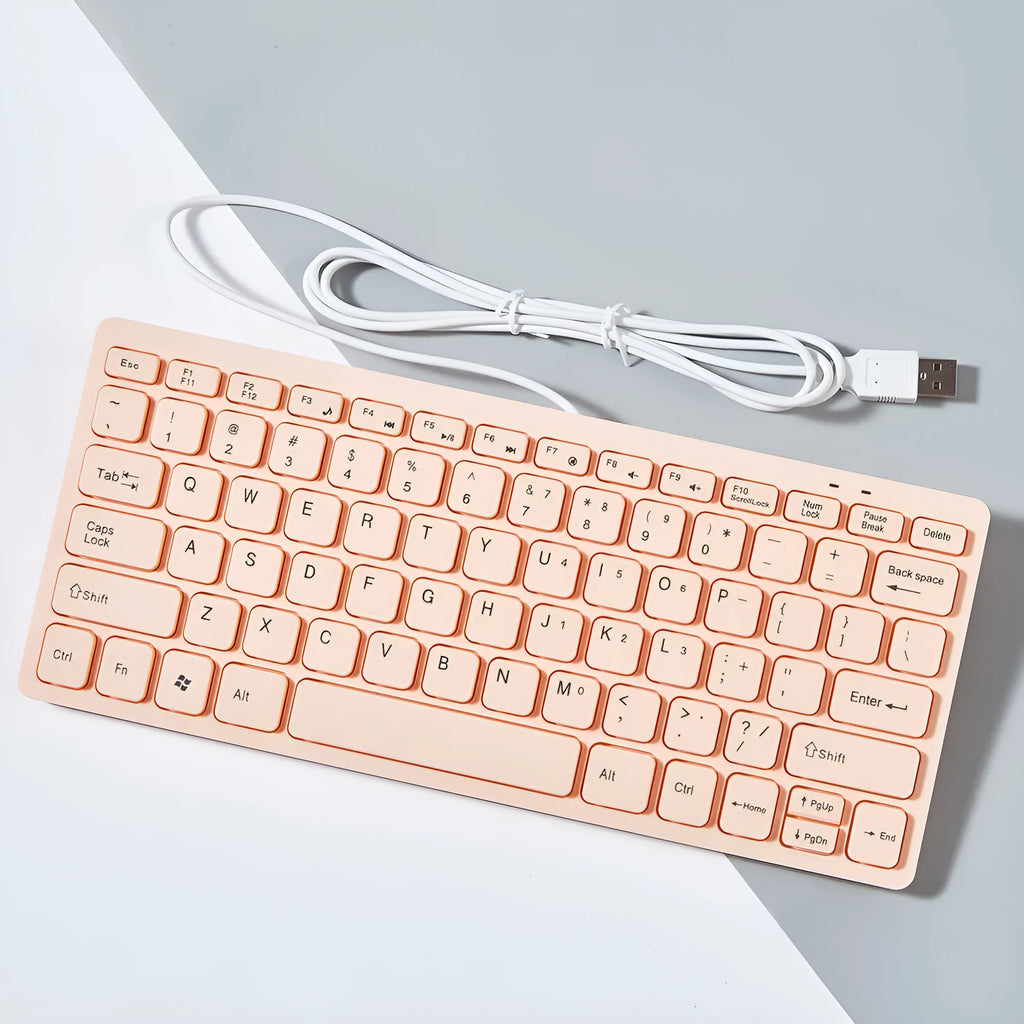Compact USB wired keyboard in four colour options showing dimensions and quiet key design