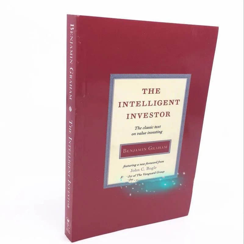 The Intelligent Investor paperback book by Benjamin Graham showing financial investment cover