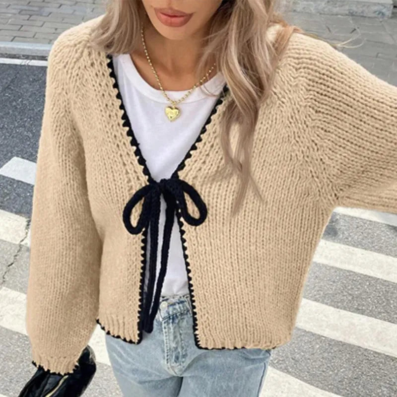 Women's grey lace-up cardigan sweater with crochet flower detail on front