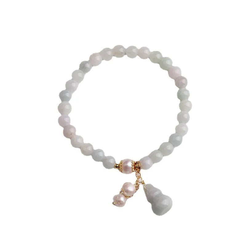 Chinese style jade bracelet with gourd design featuring natural emerald jade ins material.