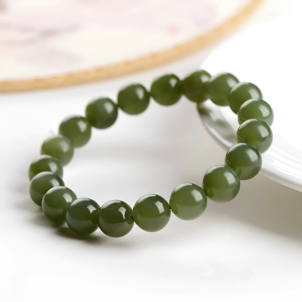 Polished Hetian jade ball bracelet showing spherical beads on a string.