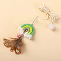 Blue feather cat rope toy hanging from door with elastic swing design and sticky buckle clamp