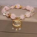 Women's yellow agate crystal bracelet on a gold silk cord, khaki colour.