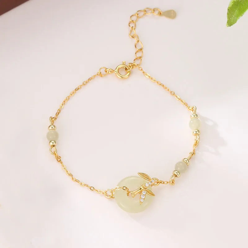 Women's antique-style 925 silver bracelet with Hetian jade and a gold-toned safety buckle clasp.