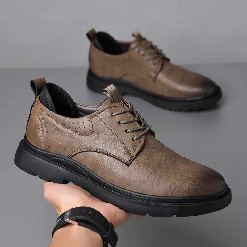 Men's black and brown leather casual sneakers with sewing line details on a two-layer cowhide upper.
