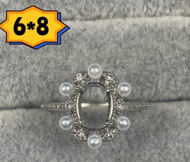 Oval denier ring with 6x8mm stone and five-pointed star element on copper band