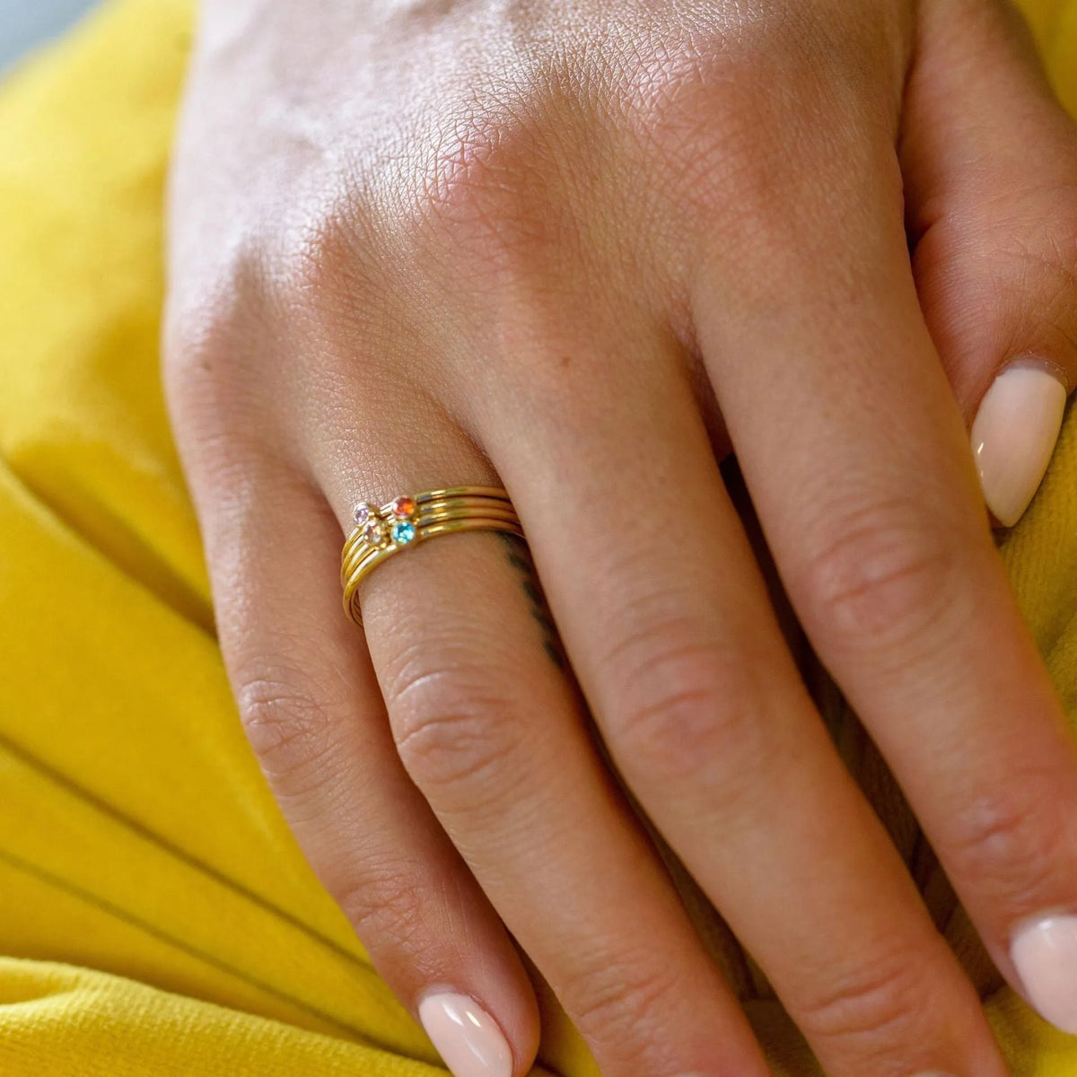December birthstone geometric engraved titanium steel ring with gold lettering on band