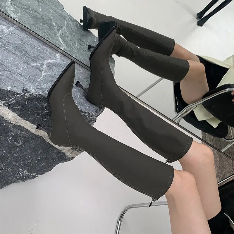 Women's black pointed toe below-knee boots with stiletto heel and back zipper