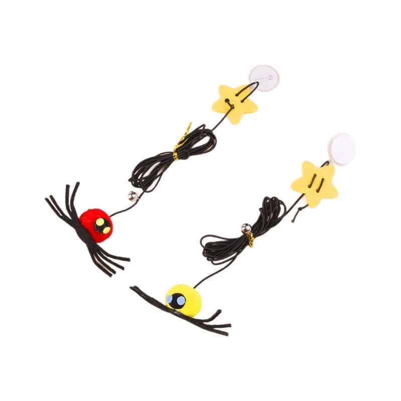 Red and yellow cat hanging door toy with elastic rope, feathers, a bell, and a spider attachment.