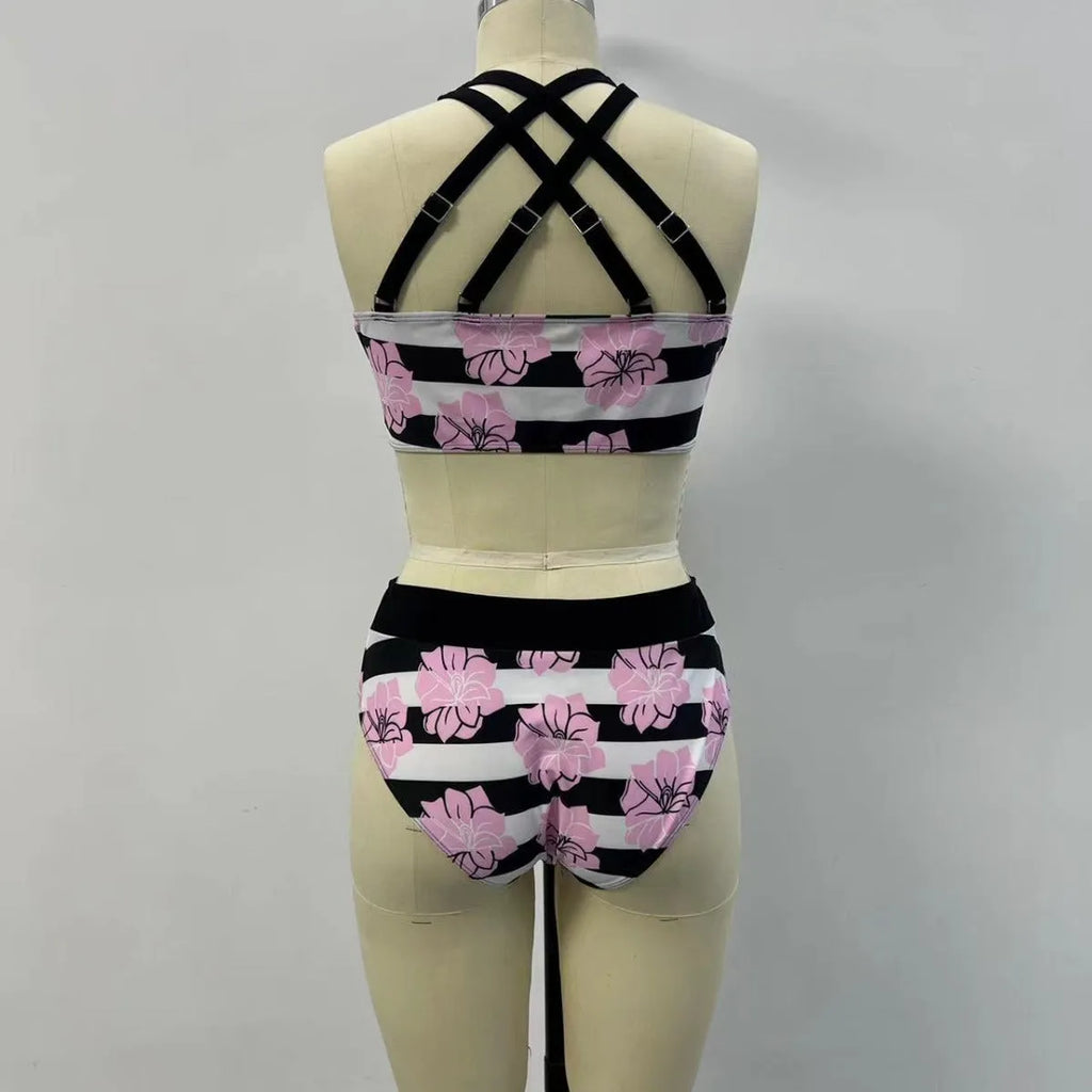 Black women's printed bikini with belly cover and split-leg design for swimming.