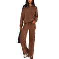 Women's long sleeve polyester leisure sports suit in a choice of colours, shown as a matching top and trousers set.