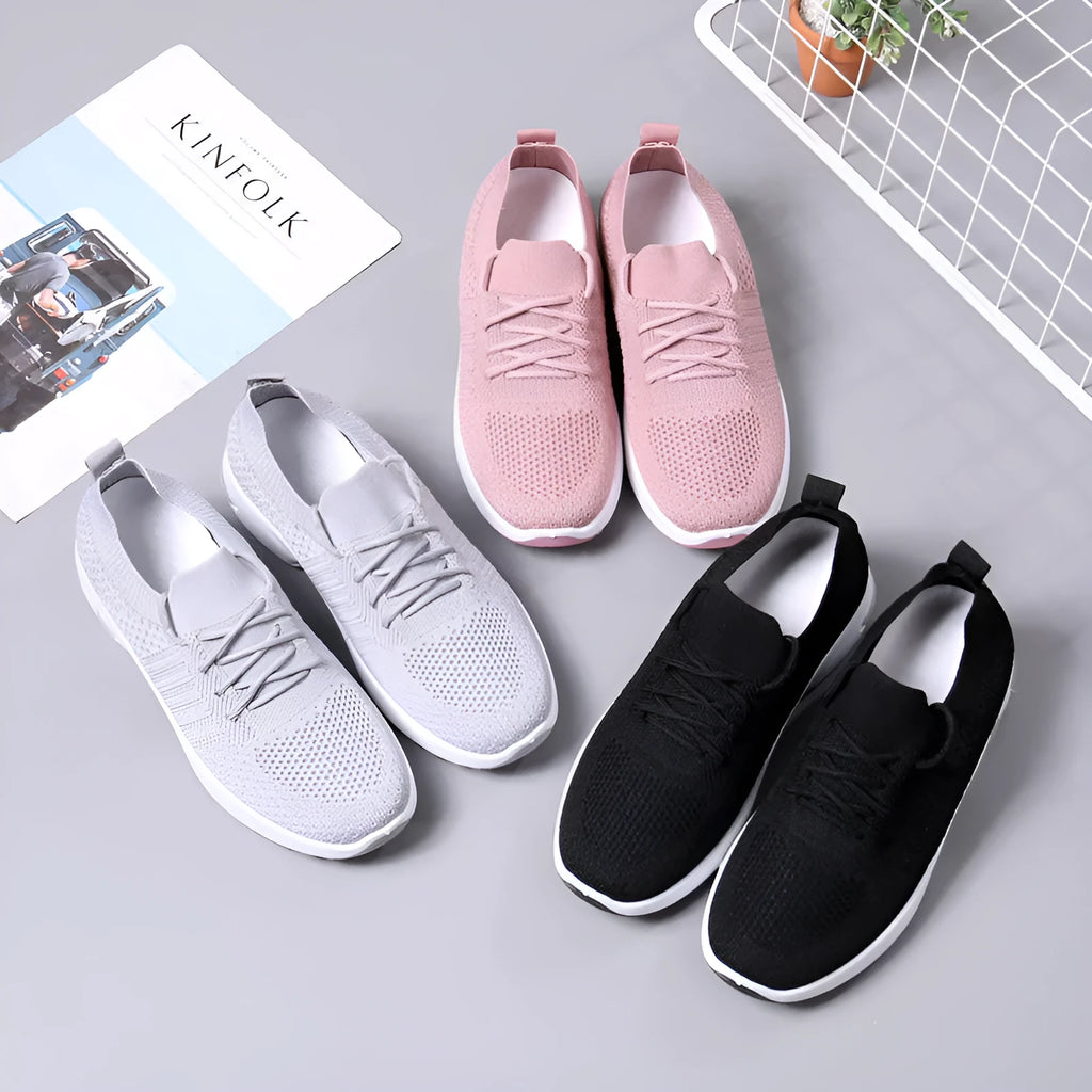 Women's round-toe lace-up sneaker in grey mesh with a soft PVC sole.