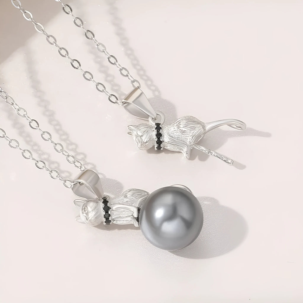 Sterling silver cat pendant necklace on a chain, elegant clavicle style.