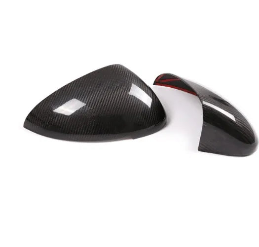 Pair of true carbon fibre rearview mirror covers for a Porsche Macan, shown in black.