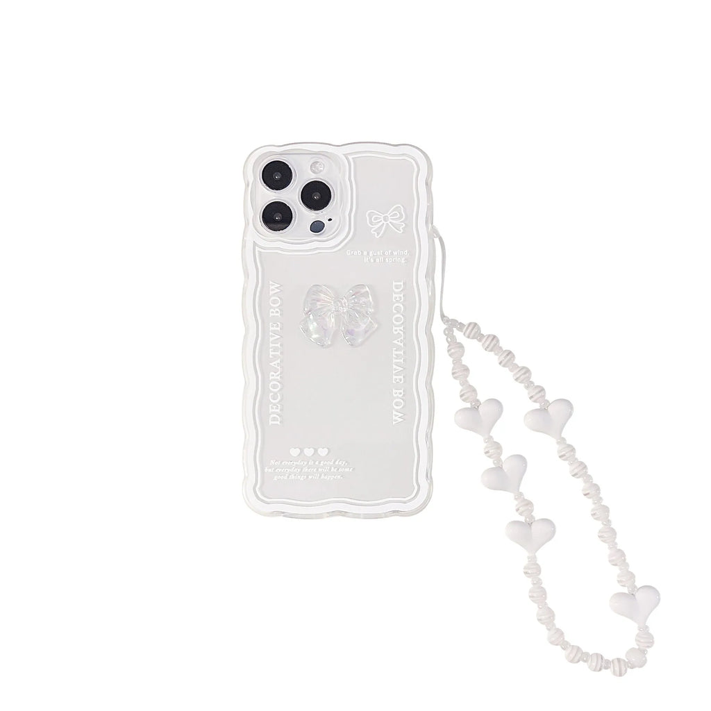 Transparent iPhone mobile phone case with a three-dimensional white bow design on the back.